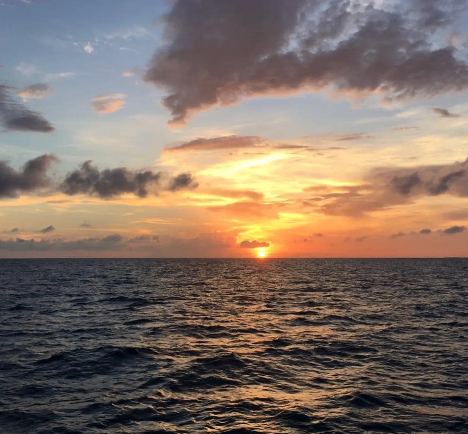 Calm ocean waters at sunset